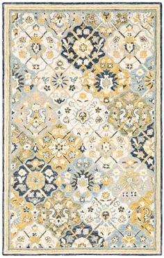 an area rug with yellow and blue accents