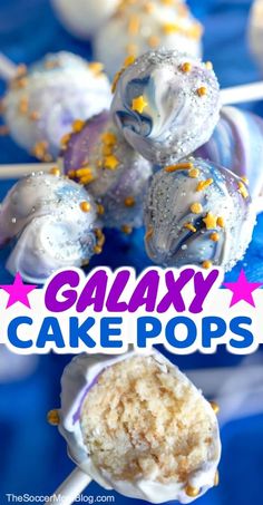 some cake pops are on a blue plate with the words galaxy cake pops above them