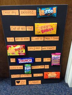 a bulletin board with candy bars on it