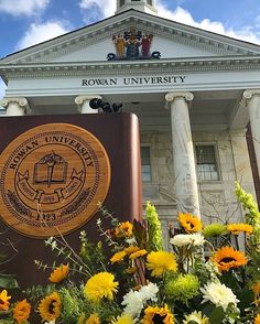 flowers in front of the rowan university building