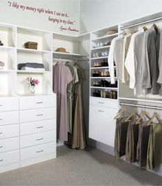 an organized closet with white cabinets and drawers