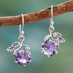 Shiny leaves crown amethyst gems in the exquisite design of these earrings by India's Shanker. The sterling silver earrings are crafted by hand featuring 7 gemstone carats and subtle oxidized contrasts. .925 Sterling silver Forbidden Fruit, Magical Jewelry, Pretty Jewelry, Amethyst Jewelry, Sterling Silver Dangle Earrings, 영감을 주는 캐릭터, Amethyst Earrings, Fantasy Jewelry, Girly Jewelry