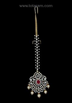 18 karat gold "detachable" diamond maang tikka cum pendant - papidi billa with color stones & south sea pearls
  this product can be used as pendant.
  this product has inter changeable stones in the pendant.
  gross weight of the pendant without chain : 12.600 grams
  gross weight of the diamond tikka chain without pendant : 4.850 grams
  length of the pendant : 2.20 inches
  width of the pendant :  1.35 inches
 - 235-GT489 - in 17.450 Grams for USD $3,890.66 USD. 
Made in India by Totaram Jewe Luxury Chandbali Tikka With Intricate Design, Luxury Festive Tikka As A Gift, Luxury Stone Work Tikka For Diwali, Luxury Gold Tikka With Stone Work, Luxury Heavy Tikka For Festive Occasions, Diamond Tikka, Diamond Maang Tikka, Papidi Billa, Vvs Diamond