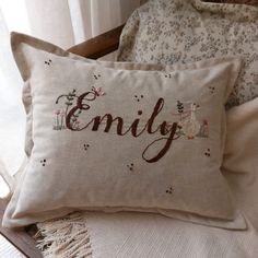 a pillow that has the word enjoy on it