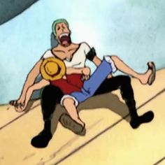 an animated image of a man being held by another man on the floor with his head down