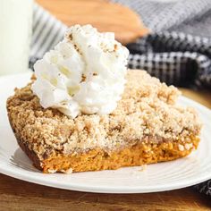 a piece of pie with whipped cream on top