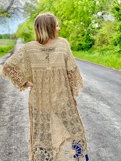 Embrace timeless fashion with The Dixieland Duster. This one-size crochet duster adds a statement piece to any outfit with its intricate details. Let your style shine with this must-have outerwear piece. model shown is a size 2/4, 5'6" tall and 34C bust fits sizes 2-18/20 very versatile in cut and fit 100% cotton Fitted Open Knit Bohemian Cover-up, Fitted Beige Bohemian Cover-up, Beige Bohemian Open Knit Crochet Dress, Bohemian Open Knit Outerwear For Spring, Spring Bohemian Crochet Open Knit Dress, Bohemian Open Knit Cover-up For Fall, Bohemian Long Sleeve Open Knit Crochet Dress, Bohemian Long Sleeve Crochet Dress With Open Knit, Bohemian Lace Cardigan For Fall