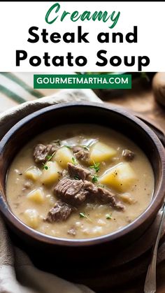 creamy steak and potato soup in a wooden bowl