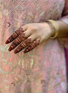 a woman with henna on her hands