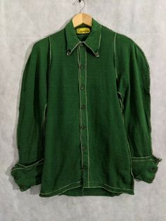 NEMETH iconic green stretchy renaissance shirt with rounded seams and big cuffs. Pit to pit: 19" Length: 31" Shoulders: 12" Shoulder to cuff: 30" Classic Long Sleeve Pre-washed Shirt, Classic Long Sleeve Pre-washed Tops, Vintage Fitted Pre-washed Tops, Fitted Vintage Pre-washed Tops, Pre-washed Long Sleeve Cotton Shirt, Pre-washed Cotton Long Sleeve Shirt, Fitted Cotton Shirt Pre-washed, Pre-washed Cotton Long Sleeve Tops, 1940s Mens Clothing