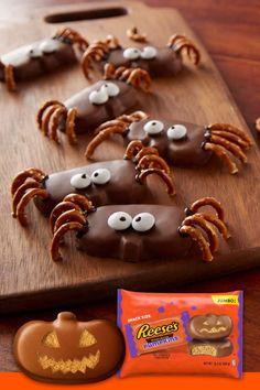 halloween treats are arranged on a cutting board