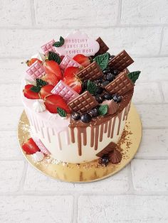 a cake decorated with strawberries and chocolate