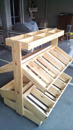 a wooden bench sitting on top of a cement floor