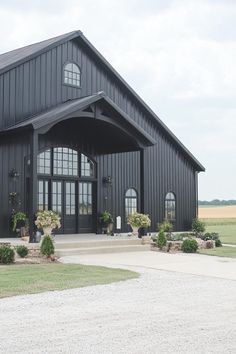 a large black building with lots of windows on the front and side of it's entrance