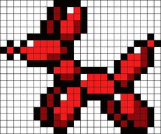 a cross stitch pattern with red and black squares in the shape of a snake's head