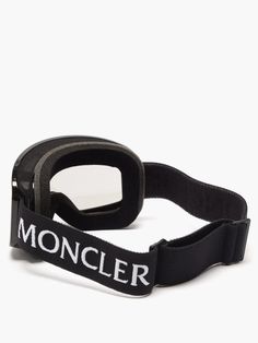 a pair of goggles with the word monocler on it, sitting against a white background