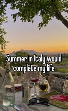 a table that has some wine on it with the words summer in italy would complete my life