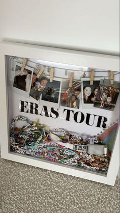 there is a white frame with pictures on it and the words eras tour written in black