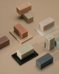 several different types of soaps sitting on top of each other