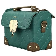 Show off your Hogwarts House pride with this adorable mini trunk handbag inspired by the wizarding world of Harry Potter! The Harry Potter Slytherin Mini Trunk comes in a rich emerald green with a quilted texture. A gold metal badge on the front and gold metal detailing adds extra luxurious style, and the removeable shoulder strap gives you versatility. This handbag is made of a high-quality polyurethane to ensure long-lasting color quality and durability for everyday wear. The Harry Potter Slyt Harry Potter Bag, Harry Potter Accessories, Harry Potter Hogwarts Houses, Harry Potter Slytherin, Harry Potter Merchandise, Slytherin Harry Potter, Harry Potter Gryffindor, Wizarding World Of Harry Potter, Hogwarts Houses