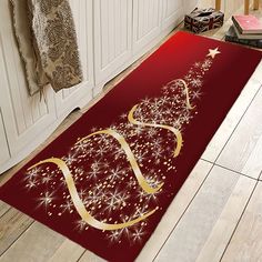 a red christmas tree rug with gold stars on it