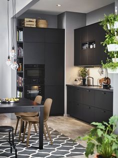 an instagram page with a black kitchen and dining room