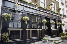 the star tavern in london is decorated with flowers