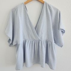 Light Airy Baby Blue Flowy Sleeves Peplum Top - Deep V - Brand New, Never Worn Size 4 Light Blue V-neck Top For Vacation, Light Wash V-neck Top For Day Out, Light Blue V-neck Blouse For Day Out, Blue Flowy Cotton Top, Flowy Cotton V-neck Tops, Flowy Blue Cotton Tops, Light Wash V-neck Blouse For Spring, Blue Flowy Cotton Blouse, Flowy Blue Cotton Blouse