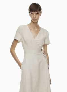 Summer Midi V-neck Dress With Tie Waist, Chic V-neck Midi Dress With Tie Fastening, Summer A-line Belted Wrap Dress, Elegant Linen V-neck Midi Dress, Casual Linen Dress With Tie Waist, Belted Midi Length V-neck Dress For Summer, Elegant Linen V-neck Dress For Spring, Summer Belted Midi V-neck Dress, Beige Summer Dress With Surplice Neckline