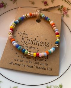 a bracelet that says, throw kindness and like it is a rainbow to the lord and be