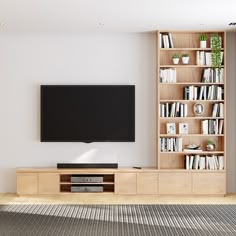 an entertainment center with bookshelves and a flat screen tv mounted on the wall