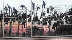 a group of people standing on top of a bridge