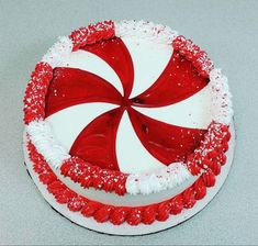 a red and white cake decorated with candy canes