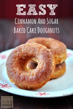 two cinnamon and sugar baked cake doughnuts on a plate with the title easy cinnamon and sugar baked cake doughnuts