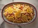 a bowl filled with lots of food on top of a table