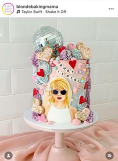 a birthday cake decorated with an image of taylor swift