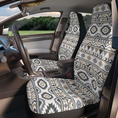 the interior of a car is decorated with native style fabric and features an intricate pattern