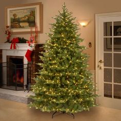 a christmas tree is lit up in the living room