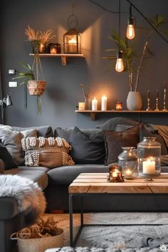 a living room filled with lots of furniture and candles on top of the coffee table