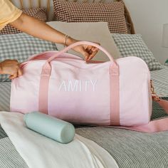 Paint a pretty picture in your imagination of how pleased your loved one will be when they receive this personalised, practical and pleasingly presentable pink canvas duffle bag. Roomy enough for everything you could need for a sleepover, day at the dance studio or fun weekend away, the pink duffle is complemented by a gorgeous rose gold zip to keep everything safe and sound. The ultimate travel accessory features sturdy cotton webbing carry handles making it easy to pick up and pop in the back of the car or even overhead compartment on a plane, plus a detachable and adjustable shoulder strap for those times you need to carry it that little bit further Make this a gift they’ll truly love for many travels trips to come with their own name or initials stylishly embroidered into the side, for Pink Rectangular Duffle Bag For School, Pink Cotton Canvas School Bag, Everyday Pink Rectangular Duffle Bag, Pink Rectangular Travel Bag As Gift, Pink Rectangular Travel Bag For Gift, Pink Gift Wrap, Pink Duffle Bag, Canvas Duffle Bag, Pink Canvas