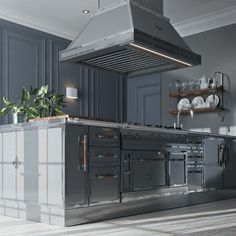 a large kitchen with an island in the middle and stainless steel appliances on the wall