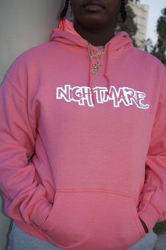 NEW O.G Pink Nightmare logo hoodie. Our cotton hoodie is lined with versatile hot pink reflective fabric. The reflective logo design features a collection of hands reaching dreams/goals. Perfect for lounging, activewear, events, and meetings. Stay warm, stay fly, you're their worst Nightmare. Pink Stretch Cotton Hoodie, Pink Cotton Stretch Hoodie, Urban Pink Hoodie For Streetwear, Stretch Graphic Print Hoodie For Streetwear, Pink Band Merch Sweatshirt For Streetwear, Pink Hip Hop Sweatshirt With Drawstring Hood, Pink Urban Hoodie With Letter Print, Urban Pink Hoodie With Letter Print, Pink Hooded Sweatshirt For Streetwear