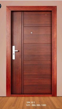 a wooden door with a white handle on the side and wood flooring behind it