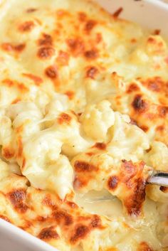 a white casserole dish filled with macaroni and cheese