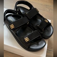 Givenchy Women’s 4g Logo Embellished 100% Leather Sandals Black Color Size 38 Brand New With Box And Receipt . Org. Price With Tax 1010$ Comes From A Pet Free And Smoke Free Home Designer Sandals With Gold-tone Hardware And Round Toe, Luxury Sandals With Gold-tone Hardware And Round Toe, Designer Black Sandals With Rectangular Buckle, Luxury Black Sandals With Logo Strap, Givenchy Slippers, Black Sandals With Gold-tone Hardware For Evening, Givenchy Heels, Givenchy Accessories, Givenchy Black Sandals