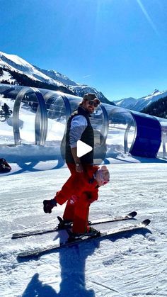 a man standing on skis in the snow