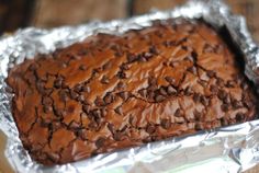 a chocolate cake sitting on top of aluminum foil