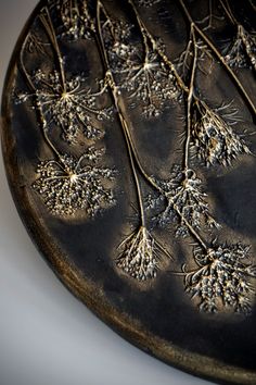 a metal plate with some plants on it