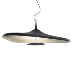 a black and white light hanging from a ceiling fixture with an oval shaped shade on it