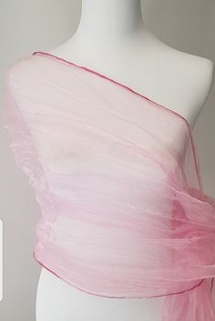 Pink Shawl in organza silk material with a shimmery shine.  Pink Scarf, pink wrap. To achieve the crinkled / crushed look the shawl is twisted whilst wet and tied with a rope and left to dry. Beautiful shawl, will make any outfit look glamorous.  Keep it or gift it.  Care Instructions Hand wash mild detergent Hang to dry naturally  Crush will remain as long as you don't iron. If you want to remove the crush affect on shawl just iron with cloth on top.  Plz note, once ironed the crush affect will Fitted Pink Organza Tulle Fabric, Fitted Pink Tulle Fabric For Wedding, Pink Organza Dupatta For Wedding, Pink Organza Dupatta For Party, Pink Spring Party Dupatta, Pink Party Dupatta For Spring, Pink Silk Dupatta For Party, Spring Party Pink Dupatta, Pink Organza Tulle Fabric For Spring